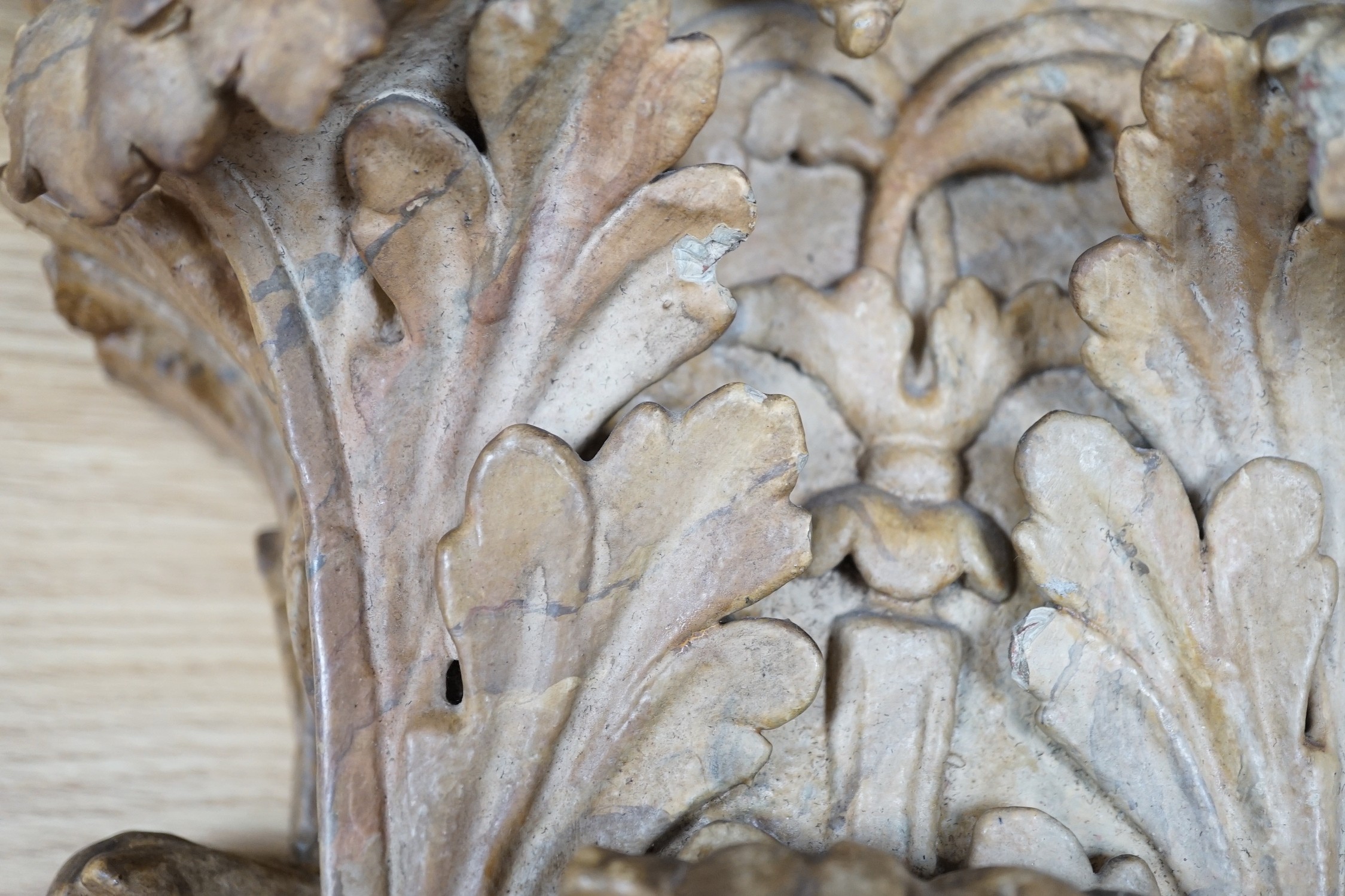 A large 19th century carved pine and gilt-gesso Corinthian capital, 33cms high x 41cm wide (at the top)